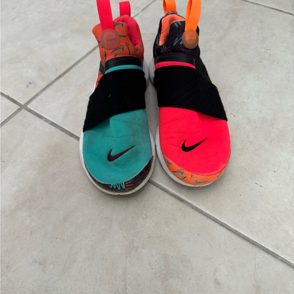 Kids orange and turquoise Nikes size 5